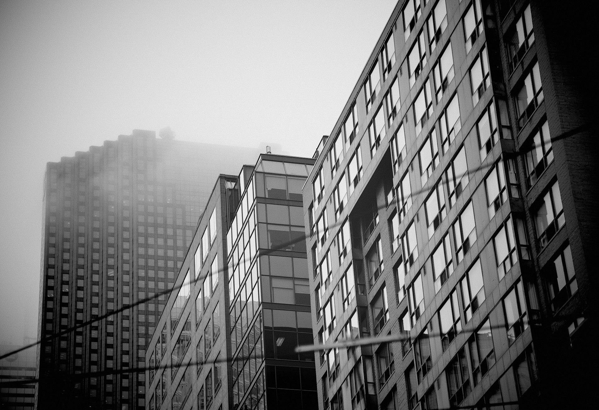 grayscale photography of high-rise buildings